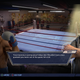 Creed and Rocky stand and talk inside of gym.